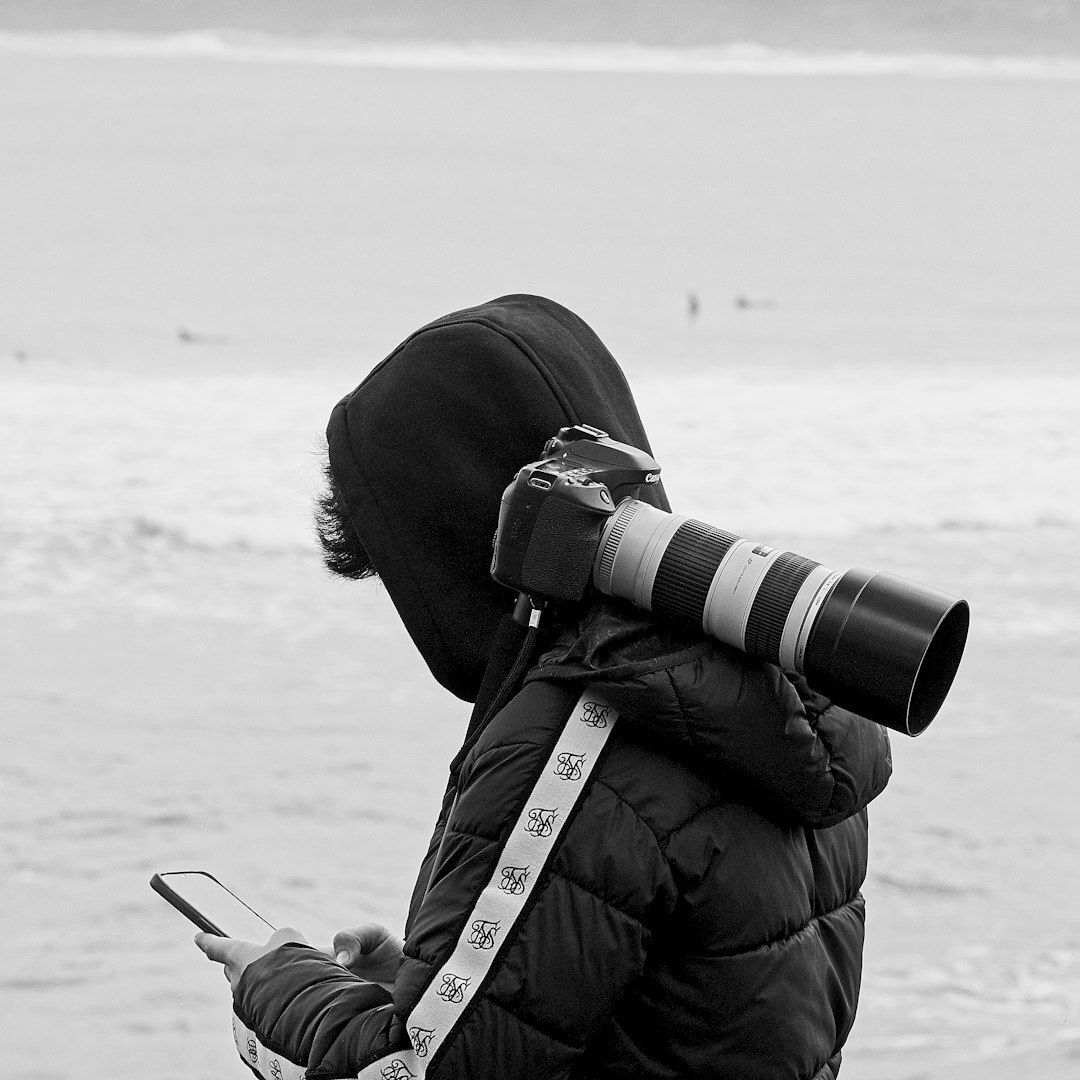 Professional portrait of a Polish female photojournalist holding a camera
